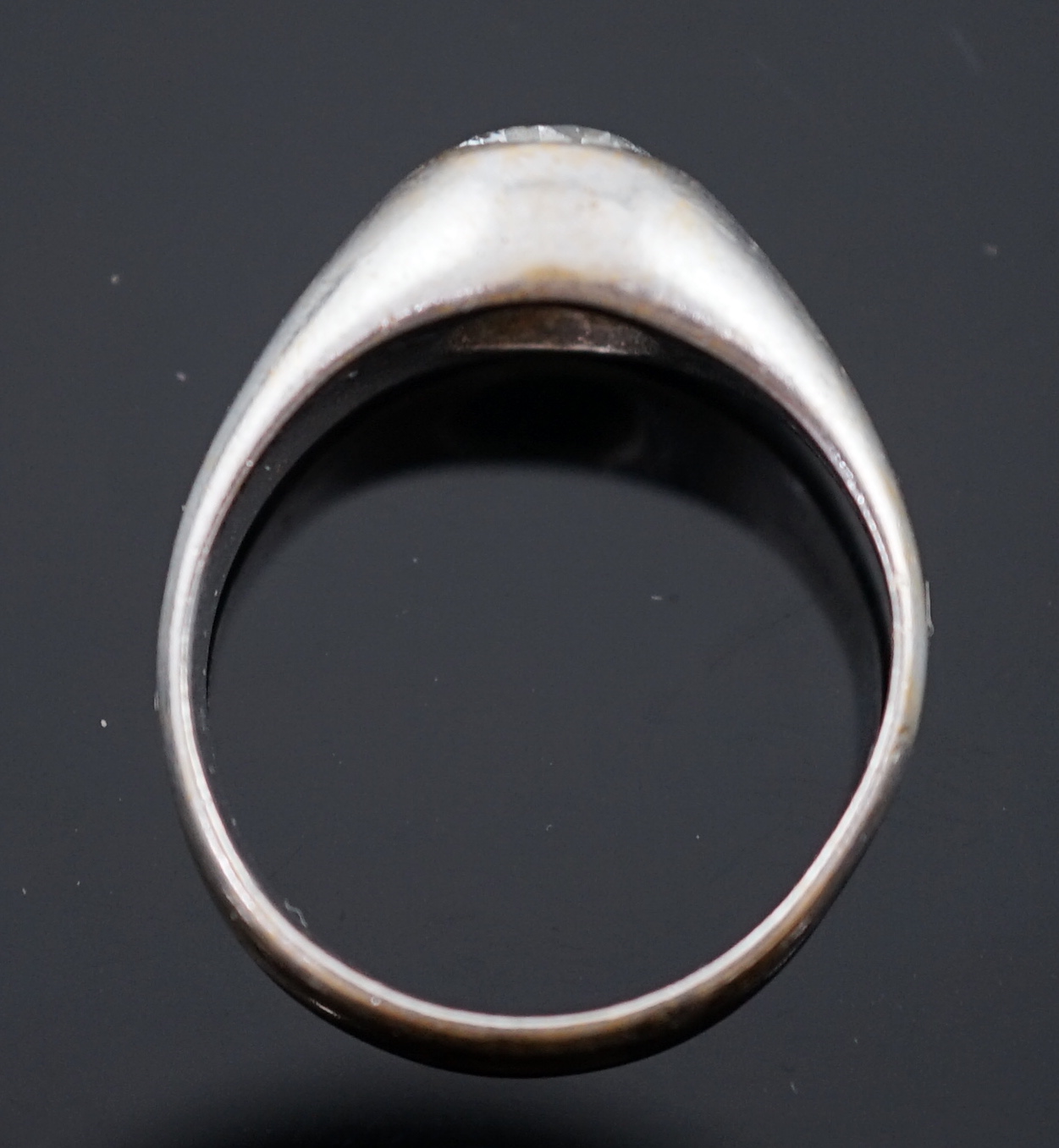 An 18ct white gold and gypsy set solitaire diamond ring